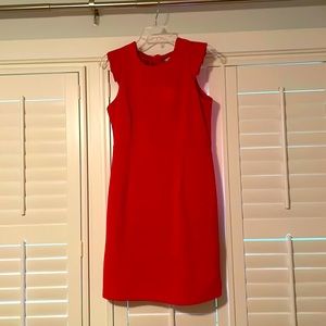 95% polyester 5% spandex ruffle sleeve detail and square back with tie